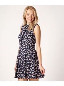 Dark Blue Floral Shirt Dress - length: mid thigh; neckline: shirt collar/peter pan/zip with opening; sleeve style: sleeveless; waist detail: twist front waist detail/nipped in at waist on one side/soft pleats/draping/ruching/gathering waist detail; bust detail: buttons at bust (in middle at breastbone)/zip detail at bust; secondary colour: ivory; predominant colour: navy; occasions: casual, evening, holiday; fit: fitted at waist & bust; style: fit & flare; fibres: cotton - 100%; hip detail: soft pleats at hip/draping at hip/flared at hip; sleeve length: sleeveless; texture group: cotton feel fabrics; trends: high impact florals; pattern type: fabric; pattern size: small & busy; pattern: florals