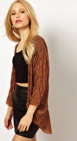 Embellished Shrug - pattern: plain; length: below the bottom; neckline: collarless open; bust detail: ruching/gathering/draping/layers/pintuck pleats at bust; style: open front; predominant colour: terracotta; secondary colour: bronze; occasions: casual, evening, work, holiday; fibres: polyester/polyamide - mix; fit: loose; shoulder detail: added shoulder detail; back detail: longer hem at back than at front; sleeve length: 3/4 length; sleeve style: standard; trends: metallics; pattern type: knitted - big stitch; pattern size: standard; texture group: jersey - stretchy/drapey; embellishment: beading