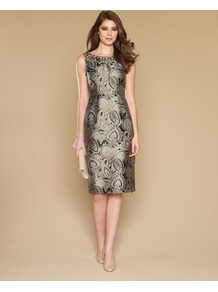 Mariana Shift Dress - style: shift; neckline: slash/boat neckline; sleeve style: capped; fit: tailored/fitted; back detail: low cut/open back; predominant colour: stone; occasions: evening, occasion; length: on the knee; fibres: polyester/polyamide - mix; shoulder detail: added shoulder detail; sleeve length: sleeveless; texture group: structured shiny - satin/tafetta/silk etc.; pattern type: fabric; pattern size: big & busy; pattern: patterned/print; embellishment: jewels