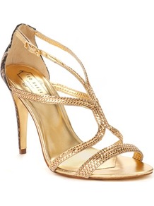 Ted Baker Tilbey Metal Chain Sandal - predominant colour: gold; occasions: evening, occasion, holiday; material: leather; heel height: high; ankle detail: ankle strap; heel: standard; toe: open toe/peeptoe; style: strappy; trends: metallics; finish: metallic; pattern: plain; embellishment: chain/metal