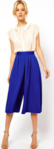 Culottes - pattern: plain; style: shorts; waist: high rise; length: below the knee; predominant colour: navy; occasions: evening, work; fibres: polyester/polyamide - 100%; hip detail: front pleats at hip level; waist detail: narrow waistband; fit: wide leg; pattern type: fabric; texture group: jersey - stretchy/drapey
