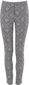 Blue And White Chambray Jacquard Slim Leg Trousers - length: standard; waist: mid/regular rise; predominant colour: mid grey; occasions: casual, work, holiday; fibres: polyester/polyamide - stretch; hip detail: fitted at hip (bottoms); waist detail: narrow waistband; trends: modern geometrics; fit: skinny/tight leg; pattern type: fabric; pattern size: big & busy; pattern: patterned/print; texture group: woven light midweight; style: standard