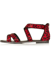 Figaro Cris Cross Sandals - predominant colour: true red; occasions: casual, work, holiday; material: leather; heel height: flat; ankle detail: ankle strap; heel: standard; toe: open toe/peeptoe; style: strappy; trends: statement prints; finish: plain; pattern: animal print