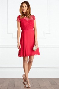 Silvana Dress - neckline: round neck; sleeve style: capped; pattern: plain; shoulder detail: contrast pattern/fabric at shoulder; bust detail: ruching/gathering/draping/layers/pintuck pleats at bust; predominant colour: hot pink; occasions: evening, occasion; length: just above the knee; fit: fitted at waist & bust; style: fit & flare; fibres: polyester/polyamide - 100%; hip detail: soft pleats at hip/draping at hip/flared at hip; sleeve length: sleeveless; texture group: sheer fabrics/chiffon/organza etc.; trends: volume; pattern type: fabric; embellishment: lace