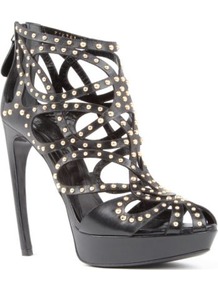 Lysippos Caged Leather Sandals - predominant colour: black; occasions: evening, occasion; material: leather; embellishment: studs; ankle detail: ankle strap; heel: banana; toe: open toe/peeptoe; style: gladiators; trends: metallics; finish: plain; pattern: plain; heel height: very high
