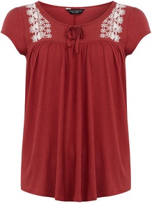 Brick Red Peasant Top - neckline: round neck; sleeve style: capped; pattern: plain; shoulder detail: contrast pattern/fabric at shoulder; bust detail: ruching/gathering/draping/layers/pintuck pleats at bust; predominant colour: true red; occasions: casual; length: standard; fibres: cotton - 100%; fit: straight cut; style: gypsy/peasant; sleeve length: short sleeve; pattern type: fabric; texture group: jersey - stretchy/drapey; embellishment: embroidered
