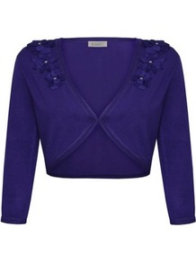 3/4 Sleeve Flower Bolero - pattern: plain; style: bolero/shrug; length: cropped; fit: slim fit; predominant colour: purple; occasions: evening, work, occasion; fibres: polyester/polyamide - 100%; shoulder detail: added shoulder detail; sleeve length: 3/4 length; sleeve style: standard; texture group: knits/crochet; collar break: medium; pattern type: knitted - fine stitch; pattern size: standard; embellishment: corsage