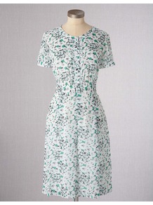 Summer Tea Dress - style: tea dress; neckline: round neck; sleeve style: puffed; fit: fitted at waist; bust detail: buttons at bust (in middle at breastbone)/zip detail at bust; predominant colour: white; occasions: casual; length: on the knee; fibres: viscose/rayon - 100%; sleeve length: short sleeve; trends: statement prints; pattern type: fabric; pattern size: standard; pattern: patterned/print; texture group: woven light midweight