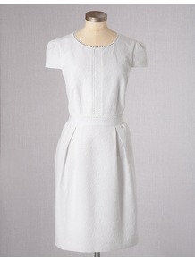 Clara Dress - style: shift; neckline: round neck; sleeve style: capped; fit: tailored/fitted; pattern: plain; bust detail: added detail/embellishment at bust; predominant colour: white; occasions: casual; length: just above the knee; fibres: cotton - mix; hip detail: sculpting darts/pleats/seams at hip; sleeve length: sleeveless; texture group: ornate wovens; pattern type: fabric; pattern size: standard; embellishment: embroidered