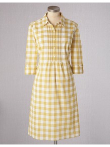 Gingham Shirt Dress - style: shirt; neckline: shirt collar/peter pan/zip with opening; fit: tailored/fitted; pattern: checked/gingham; waist detail: fitted waist; bust detail: ruching/gathering/draping/layers/pintuck pleats at bust; secondary colour: white; predominant colour: primrose yellow; occasions: casual, work; length: just above the knee; fibres: cotton - 100%; sleeve length: 3/4 length; sleeve style: standard; texture group: cotton feel fabrics; pattern type: fabric; pattern size: small & busy
