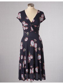 Seville Dress - style: shift; neckline: low v-neck; waist detail: fitted waist; bust detail: knot twist front detail at bust; predominant colour: navy; occasions: casual, evening, work; length: on the knee; fit: fitted at waist & bust; fibres: viscose/rayon - 100%; sleeve length: short sleeve; sleeve style: standard; trends: statement prints, glamorous day shifts; pattern type: fabric; pattern size: standard; pattern: florals; texture group: jersey - stretchy/drapey