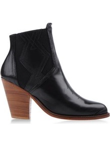 Boots Ankle Boots On Shoescribe.Com - predominant colour: black; occasions: casual, evening, work; material: leather; heel height: high; embellishment: elasticated; heel: block; toe: round toe; boot length: ankle boot; style: standard; trends: modern geometrics; finish: plain; pattern: plain