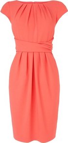 Dilys Tailored Pleat Dress Orange Carnelian - style: shift; neckline: round neck; sleeve style: capped; fit: tailored/fitted; pattern: plain; waist detail: twist front waist detail/nipped in at waist on one side/soft pleats/draping/ruching/gathering waist detail; predominant colour: coral; occasions: casual, evening, work, occasion; length: just above the knee; fibres: polyester/polyamide - mix; hip detail: structured pleats at hip; sleeve length: short sleeve; bust detail: tiers/frills/bulky drapes/pleats; pattern type: fabric; texture group: woven light midweight