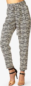 Dash Print Harem Pants - style: harem/slouch; waist: high rise; waist detail: belted waist/tie at waist/drawstring; predominant colour: black; occasions: casual, evening, holiday; length: ankle length; fibres: polyester/polyamide - 100%; hip detail: front pleats at hip level; texture group: crepes; trends: statement prints; fit: baggy; pattern type: fabric; pattern size: standard; pattern: patterned/print