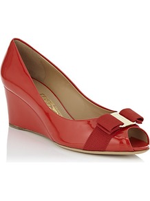 Sissi Patent Wedge Pump Red - predominant colour: true red; occasions: evening, work, occasion; material: leather; heel height: mid; heel: wedge; toe: open toe/peeptoe; style: courts; finish: patent; pattern: plain; embellishment: bow