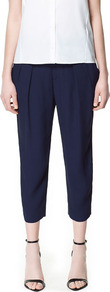 Pleated Ankle Length Trousers - pattern: plain; style: peg leg; waist: mid/regular rise; predominant colour: navy; occasions: evening, work; length: calf length; fibres: polyester/polyamide - 100%; hip detail: front pleats at hip level; texture group: crepes; fit: tapered; pattern type: fabric; pattern size: standard