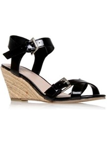 Malcolm - predominant colour: black; occasions: casual, evening, holiday; material: faux leather; heel height: mid; embellishment: buckles; ankle detail: ankle strap; heel: wedge; toe: open toe/peeptoe; style: standard; finish: patent; pattern: plain