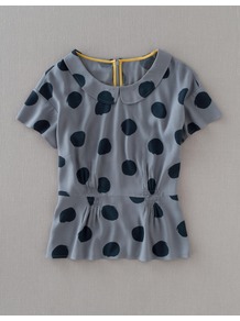 Sophia Top - pattern: polka dot; waist detail: peplum waist detail; predominant colour: mid grey; occasions: casual, evening, work; length: standard; style: top; fibres: polyester/polyamide - 100%; fit: tailored/fitted; neckline: no opening/shirt collar/peter pan; sleeve length: short sleeve; sleeve style: standard; trends: statement prints; pattern type: fabric; pattern size: small & busy; texture group: jersey - stretchy/drapey