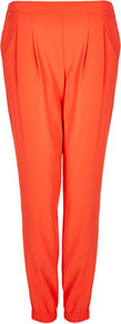 Crepe Cuffed Joggers - length: standard; pattern: plain; waist detail: fitted waist, narrow waistband; pocket detail: small back pockets, pockets at the sides; waist: mid/regular rise; predominant colour: bright orange; occasions: casual, evening, work, holiday; fibres: polyester/polyamide - 100%; hip detail: front pleats at hip level; texture group: crepes; trends: sporty redux, fluorescent; fit: slim leg; pattern type: fabric; style: standard
