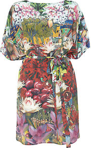 Batwing Tunic - neckline: slash/boat neckline; sleeve style: dolman/batwing; style: tunic; waist detail: belted waist/tie at waist/drawstring; occasions: casual, evening, work, holiday; fibres: silk - 100%; fit: loose; length: mid thigh; predominant colour: multicoloured; sleeve length: half sleeve; texture group: silky - light; trends: high impact florals; pattern type: fabric; pattern size: big & busy; pattern: florals, patterned/print
