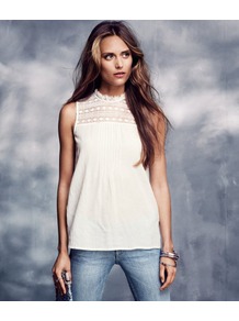 Sleeveless Blouse - pattern: plain, patterned/print; sleeve style: sleeveless; neckline: high neck; style: blouse; predominant colour: ivory; occasions: casual, evening, work; length: standard; fibres: cotton - mix; fit: loose; bust detail: contrast pattern/fabric/detail at bust; shoulder detail: added shoulder detail; back detail: embellishment at back; sleeve length: sleeveless; texture group: sheer fabrics/chiffon/organza etc.; pattern type: fabric; pattern size: small & light