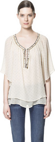 Polka Dot Tunic With Beaded Neckline - neckline: v-neck; sleeve style: angel/waterfall; bust detail: added detail/embellishment at bust; length: below the bottom; style: tunic; pattern: polka dot; predominant colour: ivory; occasions: casual, evening, holiday; fibres: polyester/polyamide - 100%; fit: loose; back detail: shorter hem at back than at front; sleeve length: 3/4 length; texture group: sheer fabrics/chiffon/organza etc.; pattern type: fabric; pattern size: small & light; embellishment: beading