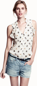 Blouse - neckline: low v-neck; sleeve style: sleeveless; style: blouse; bust detail: ruching/gathering/draping/layers/pintuck pleats at bust; predominant colour: ivory; occasions: casual, work, holiday; length: standard; fibres: polyester/polyamide - 100%; fit: body skimming; shoulder detail: flat/draping pleats/ruching/gathering at shoulder; back detail: longer hem at back than at front; sleeve length: sleeveless; texture group: sheer fabrics/chiffon/organza etc.; trends: sculptural frills; pattern type: fabric; pattern size: standard; pattern: patterned/print