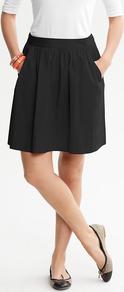 Circle Skirt - pattern: plain; fit: loose/voluminous; style: pleated; hip detail: side pockets at hip; waist: high rise; predominant colour: black; occasions: casual, evening, work; length: just above the knee; fibres: cotton - stretch; waist detail: narrow waistband; pattern type: fabric; pattern size: standard; texture group: jersey - stretchy/drapey