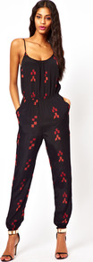 Jumpsuit In Aztec Print - sleeve style: spaghetti straps; fit: fitted at waist; hip detail: side pockets at hip; waist detail: twist front waist detail/nipped in at waist on one side/soft pleats/draping/ruching/gathering waist detail; secondary colour: true red; predominant colour: black; occasions: casual, evening, holiday; length: ankle length; neckline: scoop; fibres: viscose/rayon - 100%; sleeve length: sleeveless; style: jumpsuit; pattern type: fabric; pattern size: small & light; pattern: patterned/print; texture group: other - light to midweight