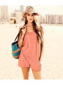Jumpsuit - fit: loose; pattern: plain; neckline: halter neck; length: short shorts; predominant colour: coral; fibres: cotton - mix; sleeve length: sleeveless; occasions: holiday; style: playsuit; pattern type: fabric; texture group: jersey - stretchy/drapey
