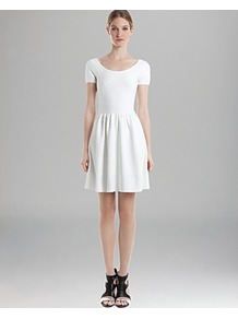Backless Dress Rappel - pattern: plain; back detail: low cut/open back; waist detail: twist front waist detail/nipped in at waist on one side/soft pleats/draping/ruching/gathering waist detail; predominant colour: white; occasions: casual, evening, holiday; length: just above the knee; fit: fitted at waist & bust; style: fit & flare; neckline: scoop; fibres: cotton - stretch; hip detail: soft pleats at hip/draping at hip/flared at hip; sleeve length: short sleeve; sleeve style: standard; pattern type: fabric; texture group: jersey - stretchy/drapey
