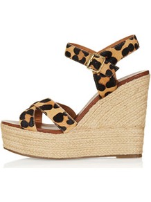 Whispered Cross Over Wedges - secondary colour: camel; predominant colour: black; occasions: casual, evening, holiday; material: leather; ankle detail: ankle strap; heel: wedge; toe: open toe/peeptoe; style: strappy; finish: plain; pattern: animal print; heel height: very high