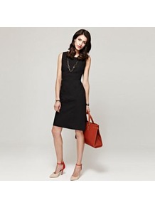 Black Shift Dress In Clever Fabric - style: shift; neckline: round neck; pattern: plain; sleeve style: sleeveless; waist detail: fitted waist; predominant colour: black; occasions: evening, work, occasion; length: just above the knee; fit: body skimming; fibres: cotton - 100%; sleeve length: sleeveless; pattern type: fabric; texture group: jersey - stretchy/drapey
