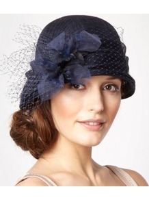 Designer Navy Dahlia Cloche Hat - predominant colour: navy; occasions: evening, occasion; type of pattern: light; style: cloche; size: standard; material: sinamay; pattern: plain; embellishment: corsage