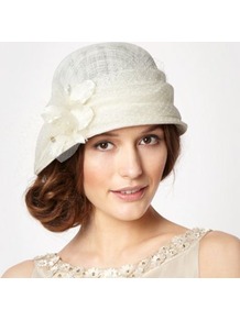 Designer Cream Dahlia Cloche Hat - predominant colour: ivory; occasions: evening, occasion, holiday; type of pattern: light; style: cloche; size: standard; material: sinamay; pattern: florals; embellishment: corsage