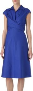 Edicola Dress - style: shift; neckline: shirt collar/peter pan/zip with opening; sleeve style: capped; pattern: plain; waist detail: fitted waist; predominant colour: royal blue; occasions: evening, work, occasion; length: on the knee; fit: soft a-line; fibres: cotton - 100%; sleeve length: short sleeve; texture group: cotton feel fabrics; bust detail: tiers/frills/bulky drapes/pleats; pattern type: fabric