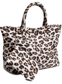 Bag - secondary colour: tan; predominant colour: stone; occasions: casual, work, holiday; type of pattern: heavy; style: tote; length: handle; size: standard; material: fabric; pattern: animal print; trends: statement prints; finish: plain