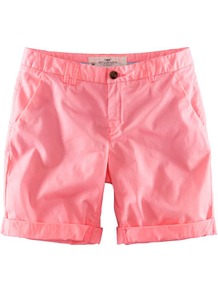 Shorts - pattern: plain; style: shorts; pocket detail: traditional 5 pocket; length: short shorts; waist: mid/regular rise; predominant colour: coral; occasions: casual, holiday; fibres: cotton - stretch; jeans & bottoms detail: turn ups; texture group: cotton feel fabrics; fit: slim leg; pattern type: fabric