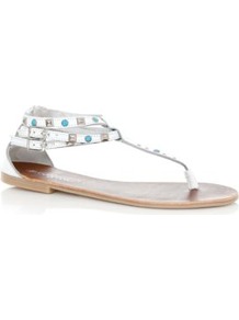 White Stud Buckle Sandals - predominant colour: white; secondary colour: denim; occasions: casual, evening, work, holiday; material: faux leather; heel height: flat; embellishment: studs; ankle detail: ankle strap; heel: standard; toe: toe thongs; style: flip flops / toe post; trends: metallics; finish: plain; pattern: plain