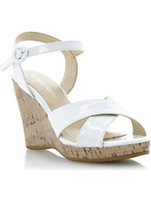 Gianna Patent Cross Strap Wedge Sandal - predominant colour: white; occasions: casual, holiday; material: leather; heel height: high; ankle detail: ankle strap; heel: wedge; toe: open toe/peeptoe; style: standard; finish: patent; pattern: plain