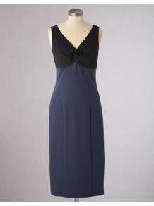 Paternoster Dress - style: shift; length: below the knee; neckline: low v-neck; fit: empire; pattern: plain; sleeve style: sleeveless; bust detail: knot twist front detail at bust; predominant colour: navy; occasions: casual, evening, work, occasion; fibres: cotton - mix; sleeve length: sleeveless; trends: glamorous day shifts; pattern type: fabric; pattern size: standard; texture group: jersey - stretchy/drapey