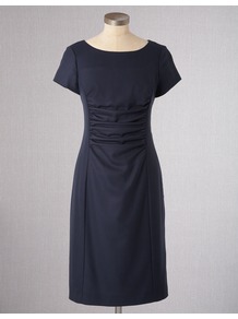 Walbrook Wool Dress - style: shift; neckline: round neck; fit: tailored/fitted; pattern: plain; waist detail: twist front waist detail/nipped in at waist on one side/soft pleats/draping/ruching/gathering waist detail; predominant colour: navy; occasions: evening, work; length: on the knee; fibres: wool - stretch; sleeve length: short sleeve; sleeve style: standard; texture group: knits/crochet; pattern type: knitted - fine stitch