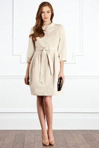 Kya Coat - pattern: plain; style: single breasted; length: on the knee; collar: high neck; predominant colour: stone; occasions: evening, work, occasion; fit: tailored/fitted; fibres: cotton - mix; hip detail: ruching/gathering at hip; waist detail: belted waist/tie at waist/drawstring; sleeve length: 3/4 length; sleeve style: standard; texture group: cotton feel fabrics; collar break: high; pattern type: fabric