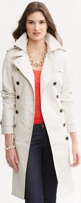 Classic Trench - pattern: plain; shoulder detail: obvious epaulette; bust detail: added detail/embellishment at bust; style: trench coat; collar: standard lapel/rever collar; length: mid thigh; predominant colour: ivory; occasions: casual, evening, work, occasion; fit: tailored/fitted; fibres: cotton - 100%; waist detail: peplum detail at waist; back detail: back vent/flap at back; sleeve length: long sleeve; sleeve style: standard; collar break: medium; pattern type: fabric; texture group: other - light to midweight