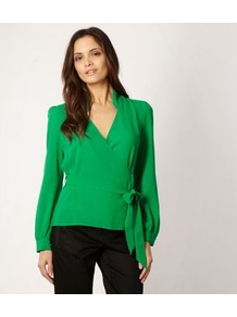 Green Crepe Wrap Top - neckline: low v-neck; sleeve style: bell sleeve; pattern: plain; style: wrap/faux wrap; waist detail: belted waist/tie at waist/drawstring; predominant colour: emerald green; occasions: evening, work; length: standard; fibres: polyester/polyamide - 100%; fit: body skimming; sleeve length: long sleeve; texture group: crepes; pattern type: fabric