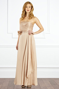 Allure Maxi Dress - style: ballgown; neckline: strapless (straight/sweetheart); pattern: plain; sleeve style: strapless; back detail: low cut/open back; waist detail: twist front waist detail/nipped in at waist on one side/soft pleats/draping/ruching/gathering waist detail; bust detail: ruching/gathering/draping/layers/pintuck pleats at bust; predominant colour: nude; occasions: evening, occasion; length: floor length; fit: fitted at waist & bust; fibres: silk - 100%; hip detail: soft pleats at hip/draping at hip/flared at hip; sleeve length: sleeveless; texture group: structured shiny - satin/tafetta/silk etc.; pattern type: fabric; embellishment: corsage