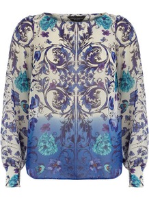 Blue Floral Ombre Print Top - neckline: round neck; sleeve style: extended cuff; predominant colour: lilac; secondary colour: pale blue; occasions: casual, evening, work, holiday; length: standard; style: top; fibres: polyester/polyamide - 100%; fit: straight cut; back detail: longer hem at back than at front; sleeve length: long sleeve; texture group: sheer fabrics/chiffon/organza etc.; trends: modern geometrics; pattern type: fabric; pattern size: big & busy; pattern: patterned/print
