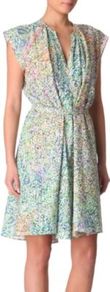 Mira Cotton Dress - style: tea dress; neckline: v-neck; sleeve style: capped; fit: fitted at waist; waist detail: fitted waist, twist front waist detail/nipped in at waist on one side/soft pleats/draping/ruching/gathering waist detail; bust detail: ruching/gathering/draping/layers/pintuck pleats at bust; occasions: casual, holiday; length: just above the knee; fibres: cotton - 100%; hip detail: structured pleats at hip, soft pleats at hip/draping at hip/flared at hip; predominant colour: multicoloured; sleeve length: sleeveless; texture group: cotton feel fabrics; trends: statement prints; pattern type: fabric; pattern size: small & busy; pattern: florals, patterned/print