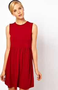 Sleeveless Smock Dress - style: smock; length: mid thigh; fit: empire; pattern: plain; sleeve style: sleeveless; waist detail: twist front waist detail/nipped in at waist on one side/soft pleats/draping/ruching/gathering waist detail; predominant colour: true red; occasions: casual, evening; fibres: viscose/rayon - stretch; neckline: crew; hip detail: soft pleats at hip/draping at hip/flared at hip; sleeve length: sleeveless; pattern type: fabric; texture group: jersey - stretchy/drapey