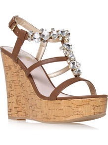 Marcie - predominant colour: chocolate brown; occasions: casual, evening, holiday; material: faux leather; embellishment: crystals; ankle detail: ankle strap; heel: platform; toe: open toe/peeptoe; style: strappy; finish: plain; pattern: plain; heel height: very high